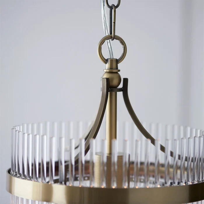 Pendant light in antique brass finish with clear glass rods