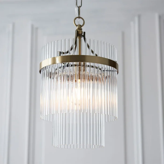 Pendant light in antique brass finish with clear glass rods