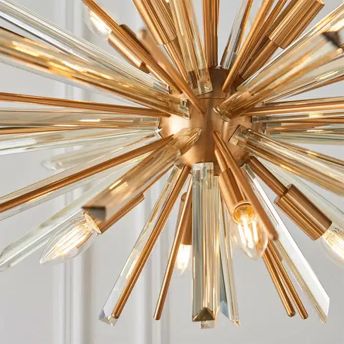 Large antique brass plated pendant light in starburst design for sitting room. living room and hallway