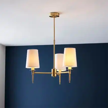 Satin brass pendant light with vintage white shades lifestyle