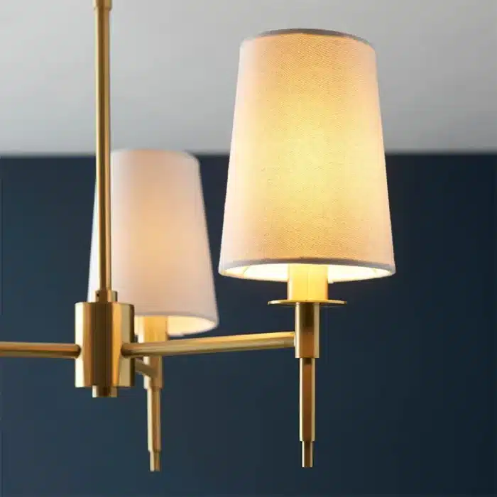 Satin brass pendant light with vintage white shades side angle
