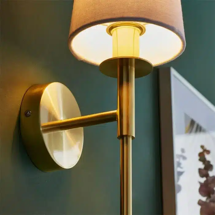 Satin brass wall light with vintage white fabric shade bulbholder view