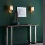 Satin brass wall light with vintage white fabric shade in living room