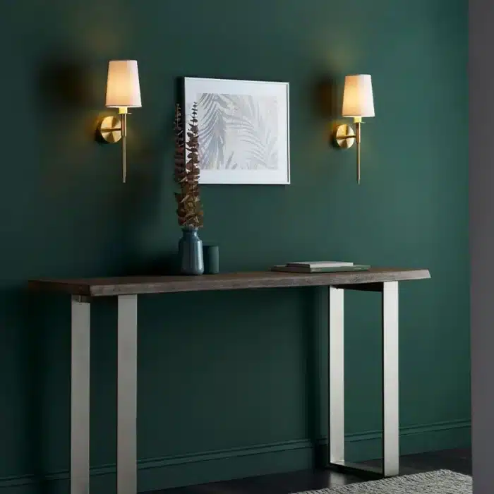 Satin brass wall light with vintage white fabric shade in living room