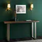 Satin brass wall light with vintage white fabric shade in living room